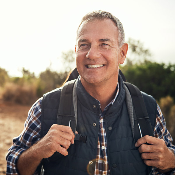 mature man smiling outside