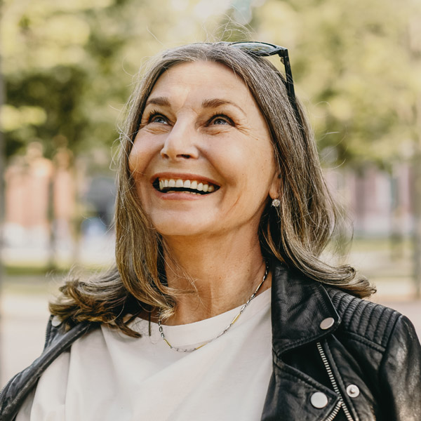 woman looking up and smiling