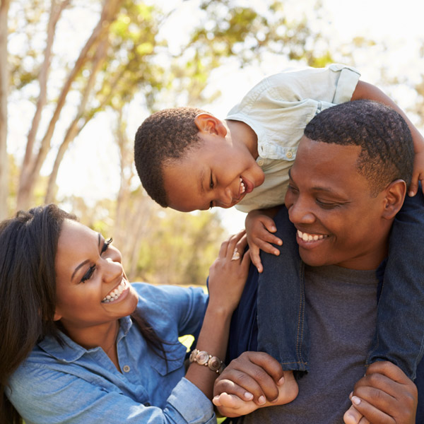 family of three smiling